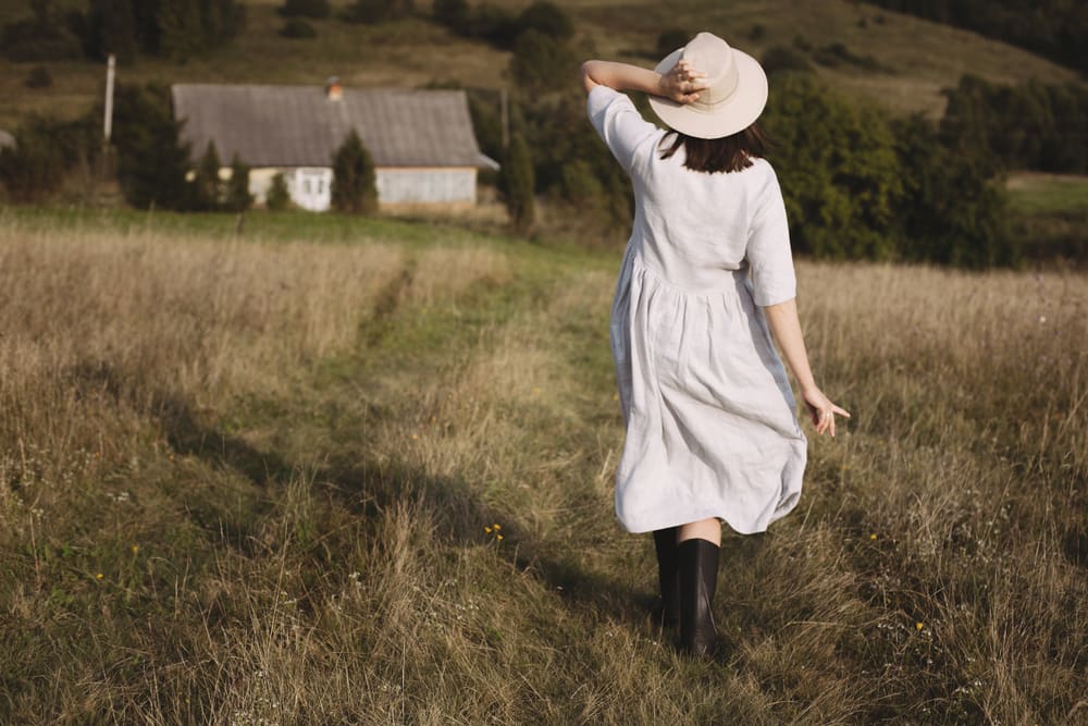 Stylish,Girl,In,Linen,Dress,And,Hat,Walking,In,Sunny